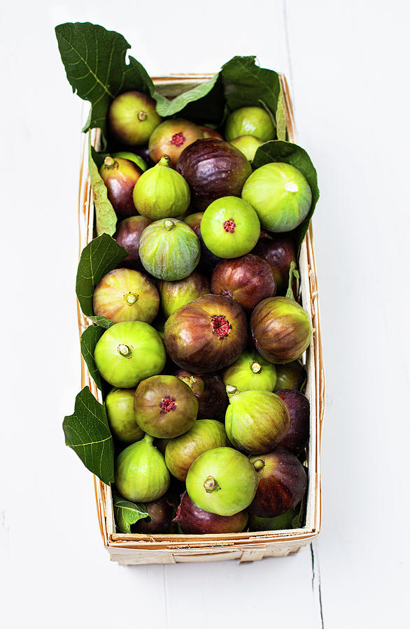 A Wooden Panier Filled With Freshly Picked Green And Purple Figs Photograph by Jamie Watson
