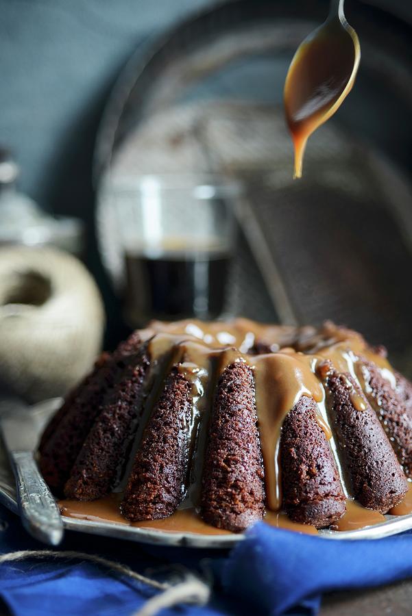 A Wreath Cake With Black Beer And Caramel Sauce Photograph by Irina Meliukh