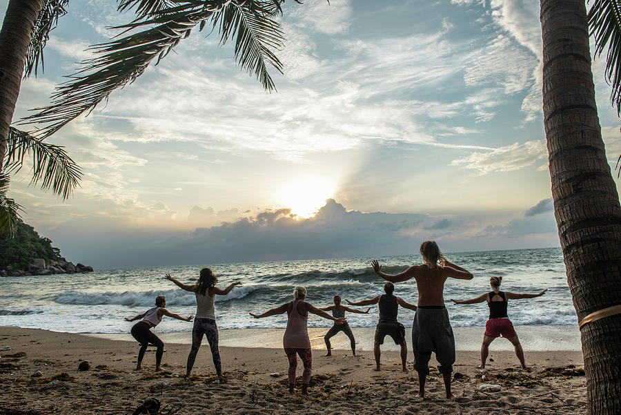 A Yoga Class On The Beach On The Island Of Koh Phangan, Thailand Photograph by Jalag / Darshana Borges