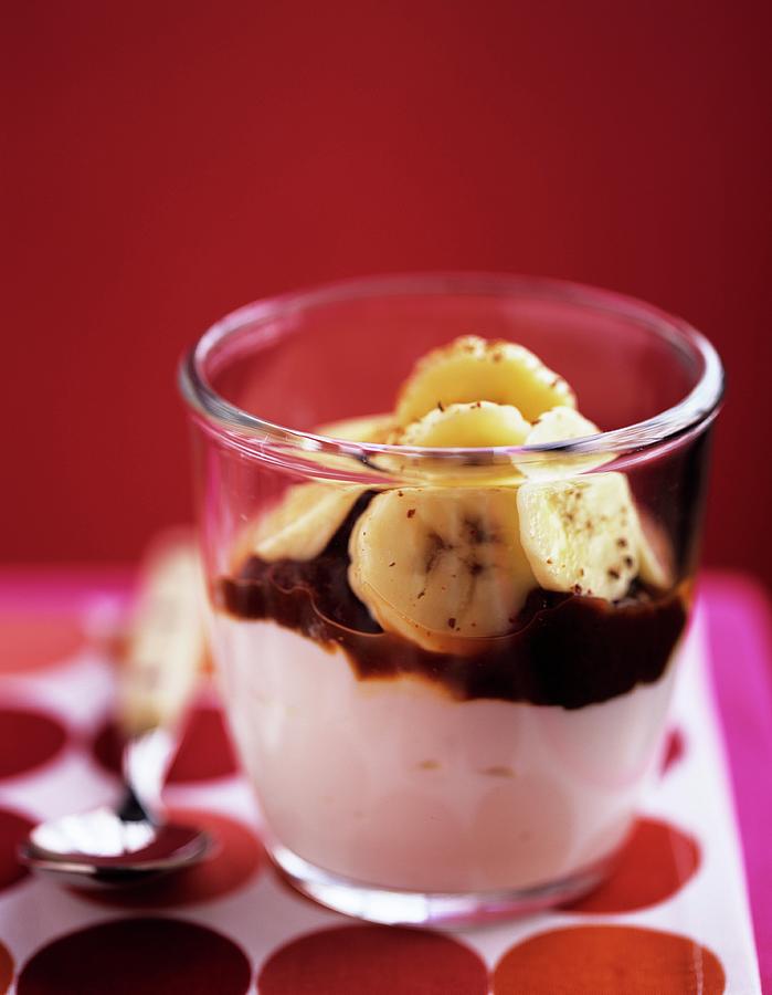 A Yoghurt Dessert With Chocolate Sauce And Bananas Photograph by Clive Streeter