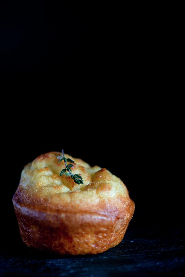 A Yorkshire Pudding On A Slate Platter Against A Black Background Photograph by Jamie Watson
