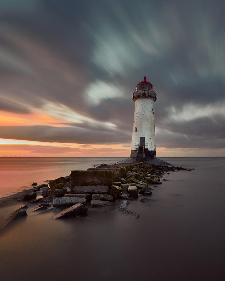 Abandoned Lighthouse At Stormy Sunset. Photograph by Mike