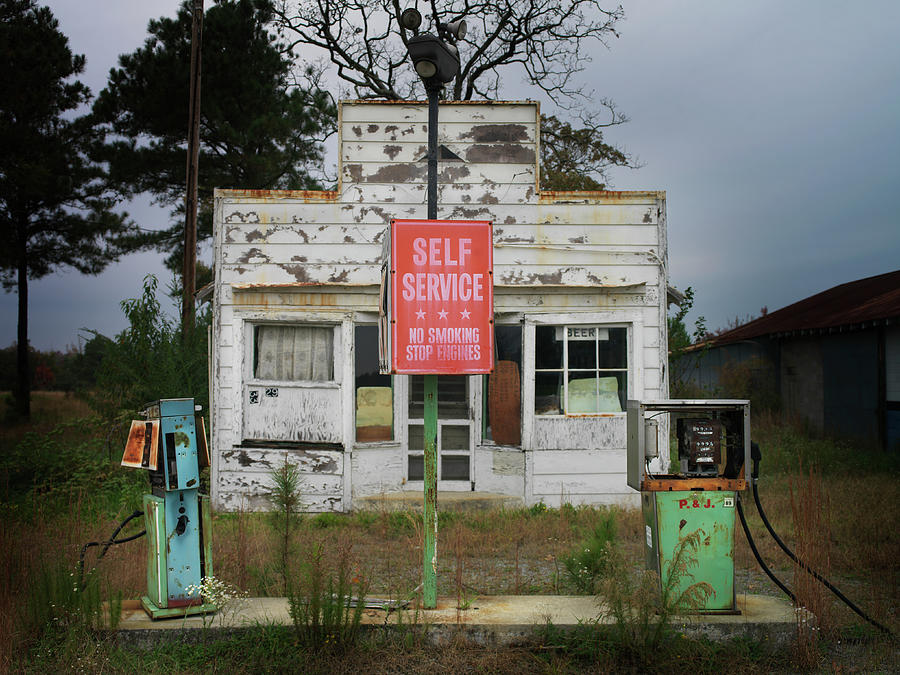 Abandoned Petrol Station At Dusk Photograph by Christian Adams