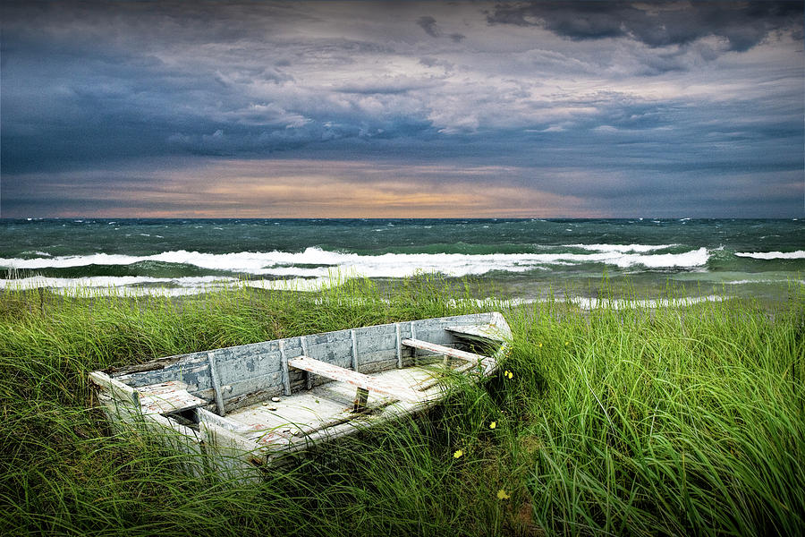 Abandoned Row Boat along the Shoreline at Sunset Photograph by Randall Nyhof