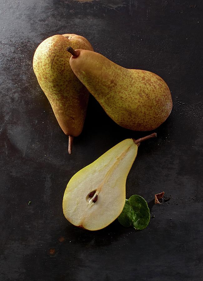 Abate Fetel Pears, Whole And Halved Photograph by Ludger Rose