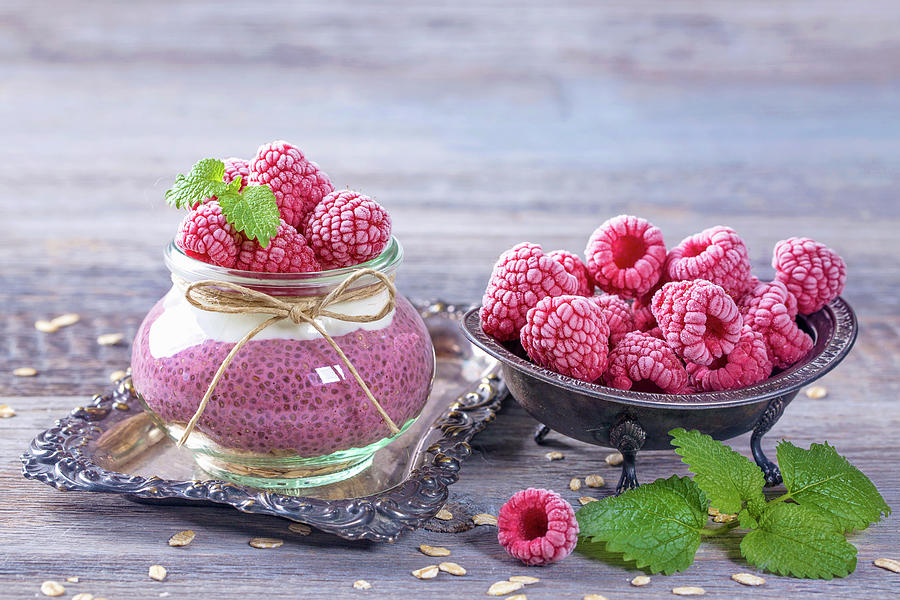 Acai Chia Pudding With Frozen Raspberries And Mint Leaves Photograph by Elena Schweitzer
