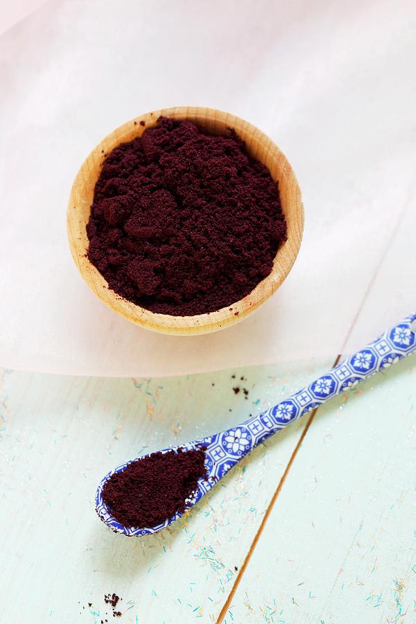 Acai Powder In A Wooden Bowl And On A Spoon Photograph by Chaudron Pastel