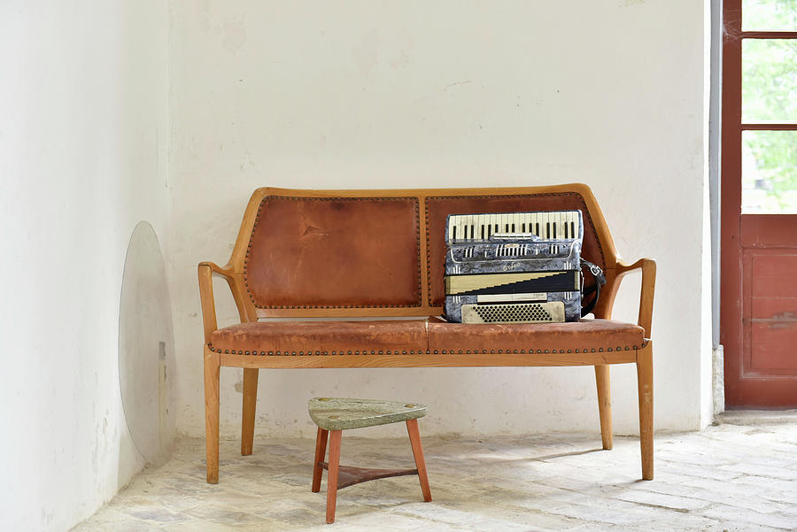 Accordion On Wooden Bench With Leather Upholstery Photograph by Magdalena Bjrnsdotter