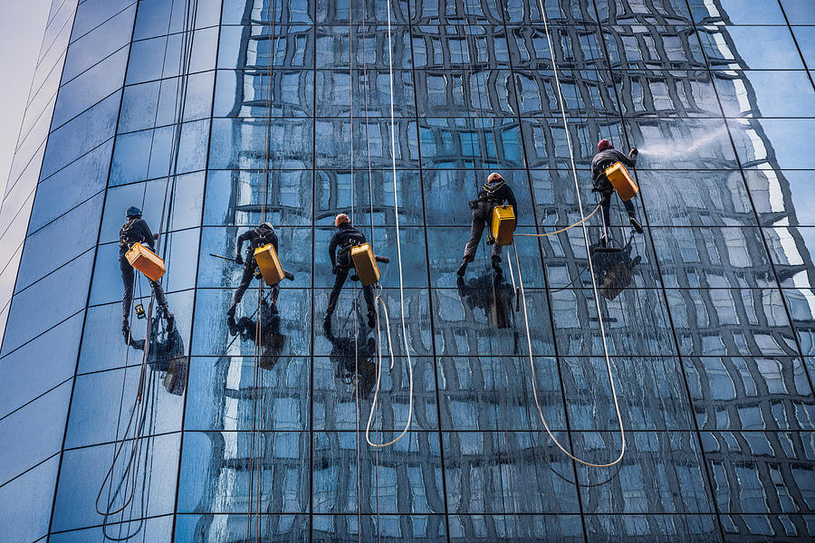 Acrobatic Cleaners Photograph by Marco Tagliarino