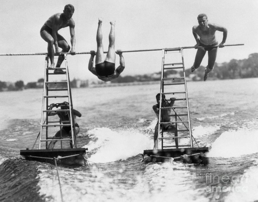 Acrobats On Lake Photograph by Bettmann Acrobats On Lake Photograph by Bettmann