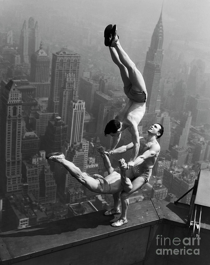 Acrobats Performing On The Empire State Photograph by Bettmann