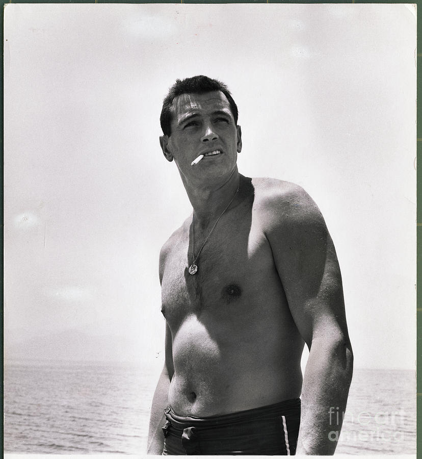 Actor Rock Hudson Smoking Photograph by Bettmann