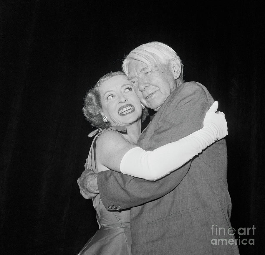 Actress Bette Davis Hugging Writer Carl Photograph by Bettmann