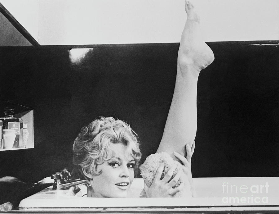 Actress Brigitte Bardot Holding Up Leg Photograph by Bettmann