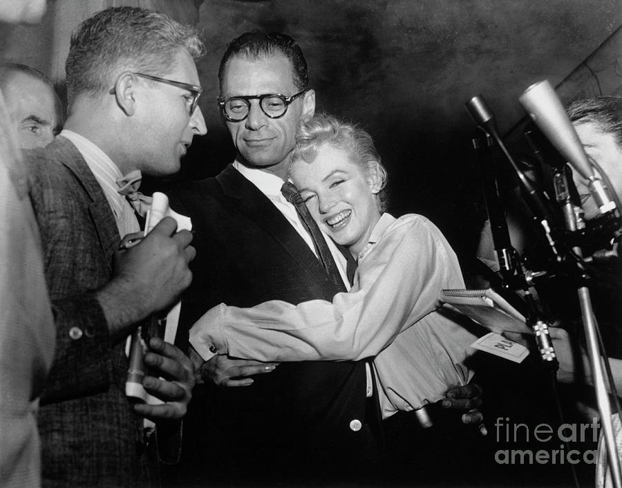Actress Marilyn Monroe Hugging Arthur Photograph by Bettmann