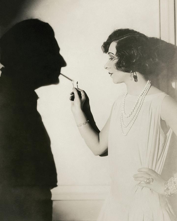 Yvonne Printemps Lighting A Shadows Cigarette Photograph by Florence Vandamm