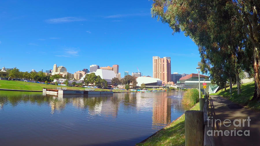 Adelaide City skyline from across the Torrens River riverbank. Photograph by Milleflore Images