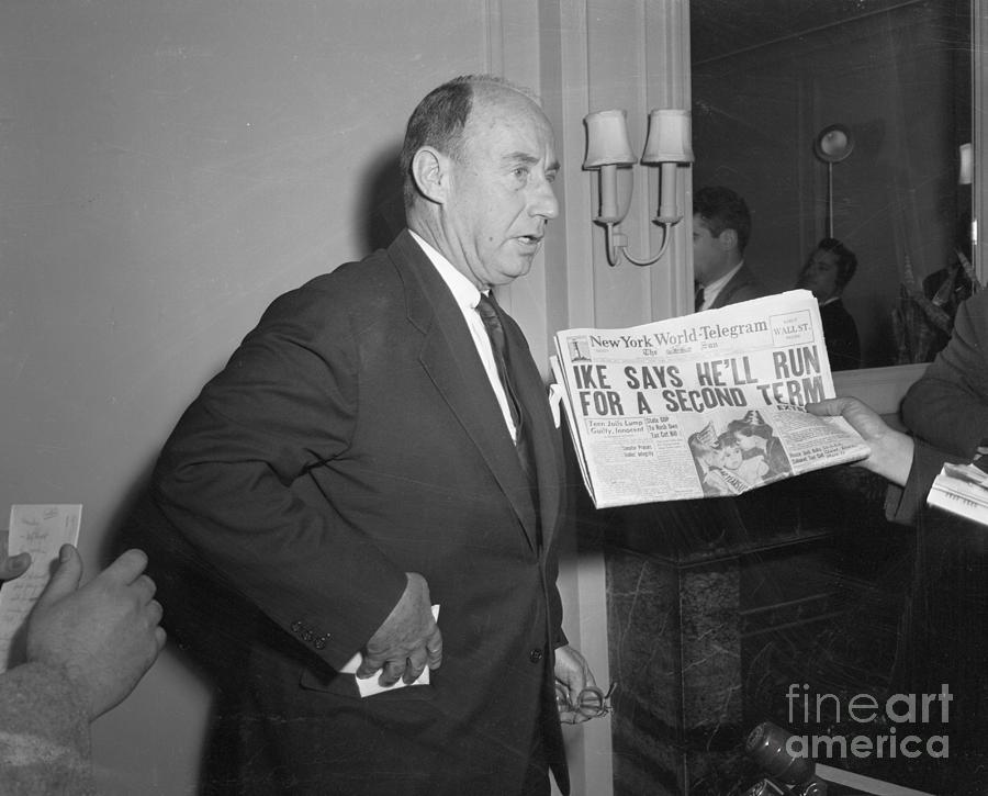 Adlai Stevenson Receiving Newspaper Photograph by Bettmann