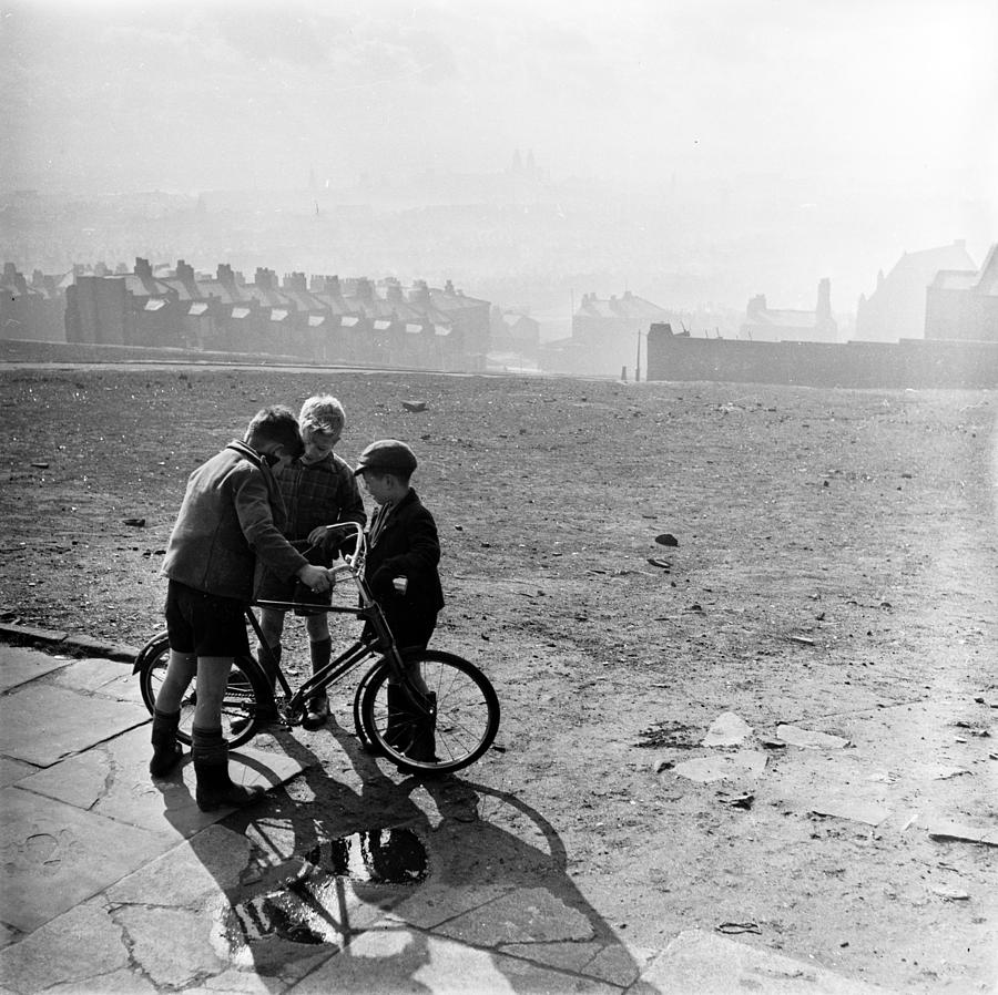 Admiring The Bike Photograph by John Chillingworth