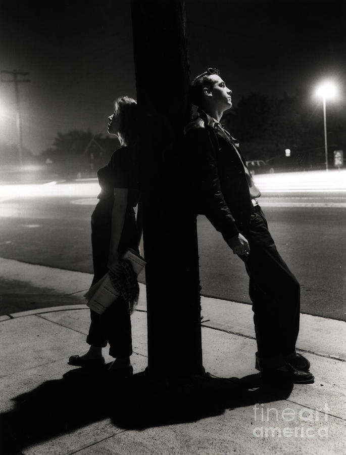 Adolescents Leaning On Pole Photograph by Bettmann