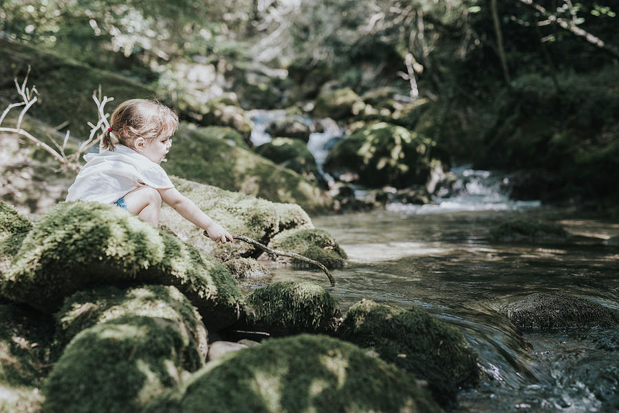 Fruit Photograph - Adorable Little Girl Playing The River In Summer, With A Cap And Shorts. by Cavan Images