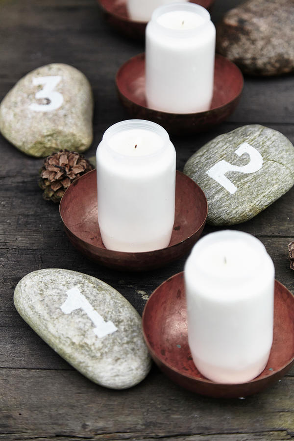 Advent Arrangement Handmade From Numbered Pebbles And Candles Photograph by Nicoline Olsen