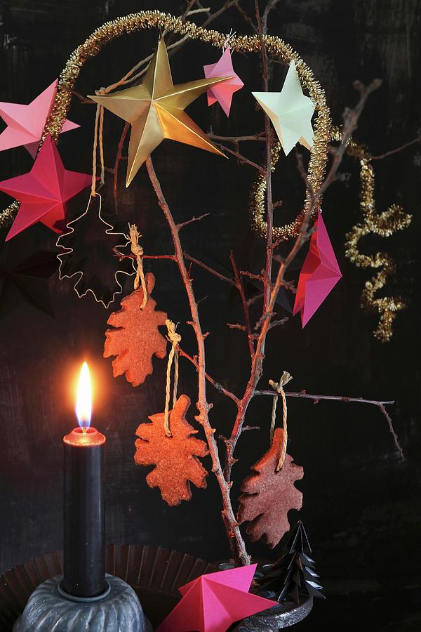 Advent Arrangement Of Chocolate Biscuits And Stars Hung From Branch Photograph by Regina Hippel