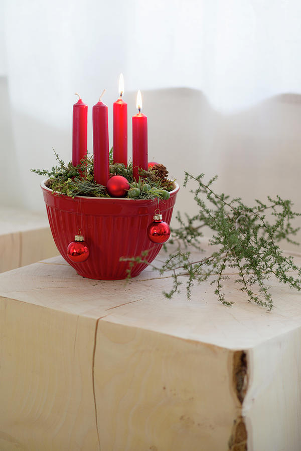 Advent Arrangement Of Four Red Candles In Red Mixing Bowl Photograph by Iris Wolf
