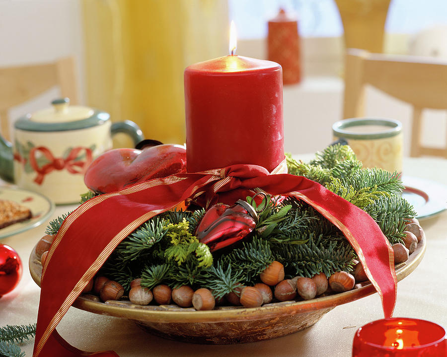Advent Arrangement With Candle And Nuts Photograph by Friedrich Strauss