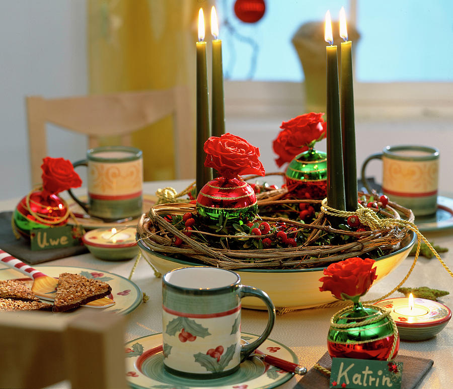 Advent Arrangement With Rose Hips And Roses Photograph by Friedrich Strauss