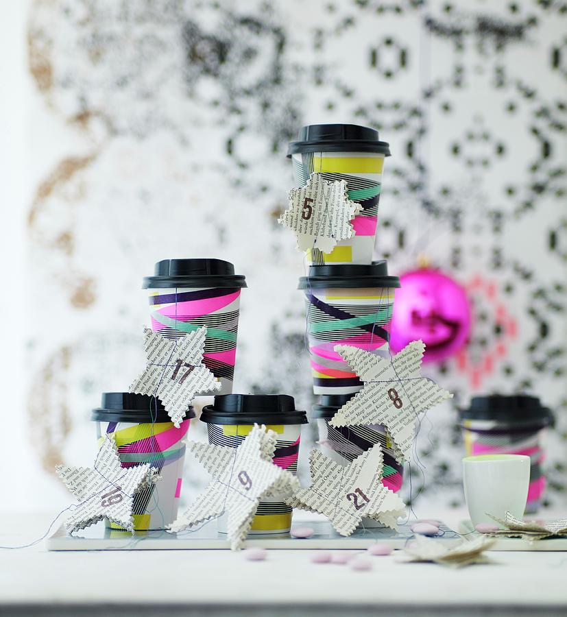 Advent Calender Hand Made From Paper Coffee Cups Decorated With Washi Tape And Paper Stars Photograph by Andreas Hoernisch