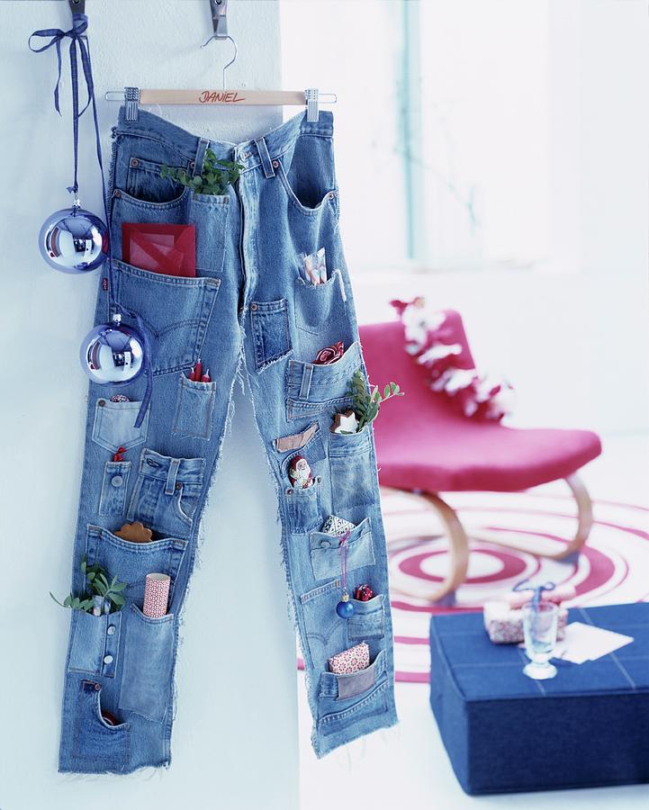 Advent Calender Made From Pair Of Jeans With Pockets Sewn Onto Legs Photograph by Matteo Manduzio