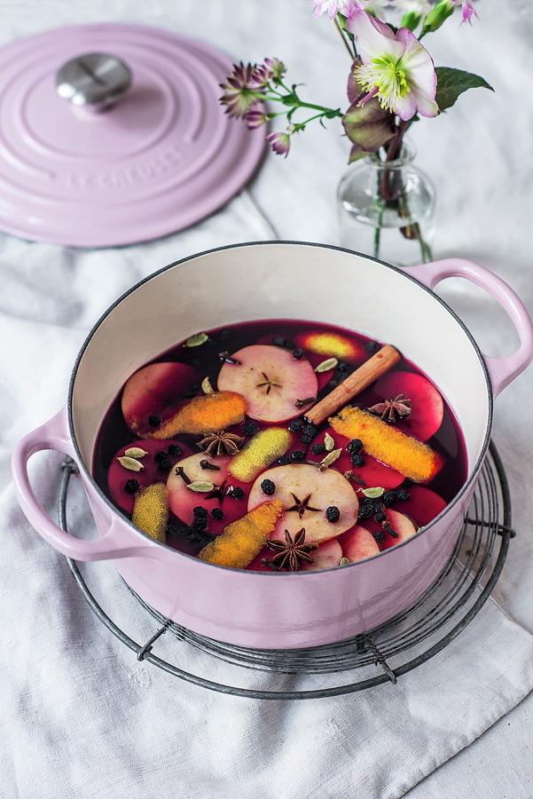 Advent Punch With Apple Slices And Spices In A Cooking Pot Photograph by Carolin Strothe