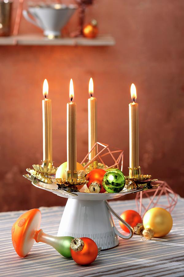 Advent Wreath Made From Gold Candles On Stand Made From Upturned Cup And Saucer Photograph by Thordis Rggeberg