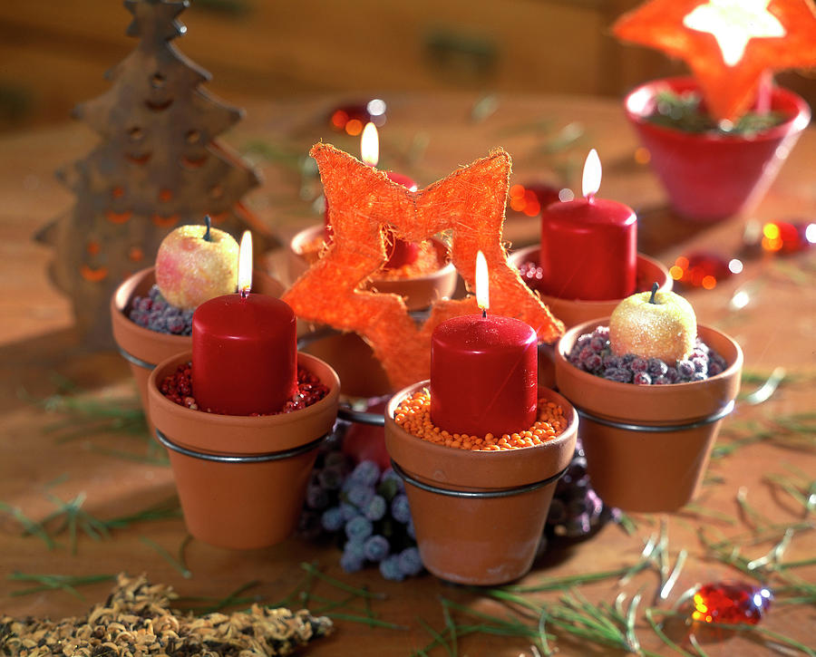 Advent Wreath Of Small Terracotta Pots In Metal Holder Photograph by Friedrich Strauss