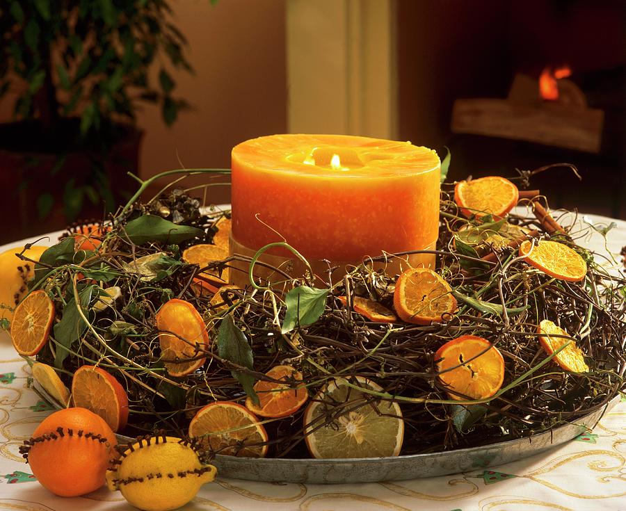 Advent Wreath With Citrus Fruit And Orange Candle Photograph by Friedrich Strauss