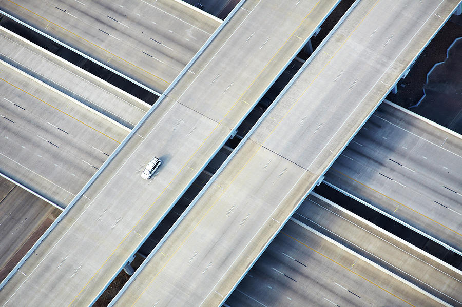Aerial Shot Of One Car On Freeway Photograph by Thomas Northcut
