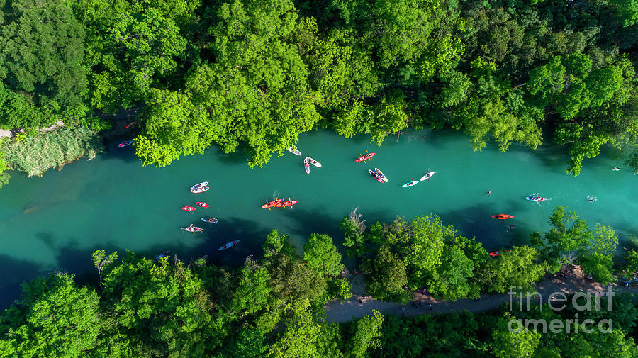 Nature Photograph - Aerial view looking over kayaks and canoes on Barton Creek, natu by Dan Herron