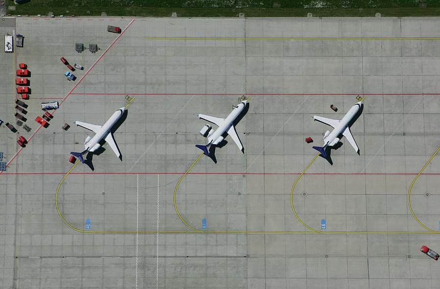 Aerial View Of A Row Of Airplanes Parked Photograph by Stephan Zirwes