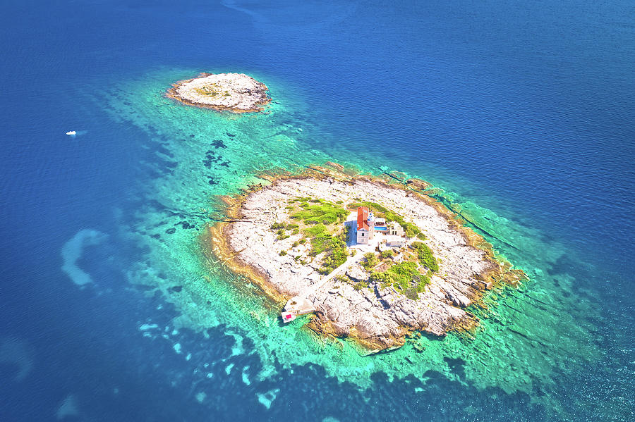 Aerial view of lonely island with lighthouse Photograph by Brch Photography