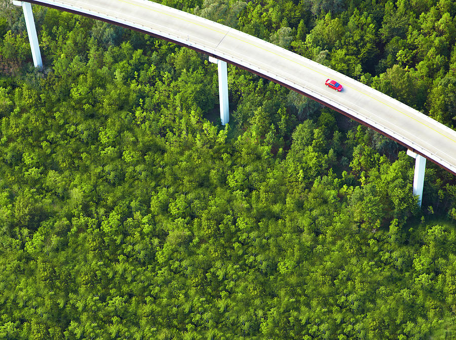 Aerial View Of Overpass With Red Car Photograph by Thomas Northcut