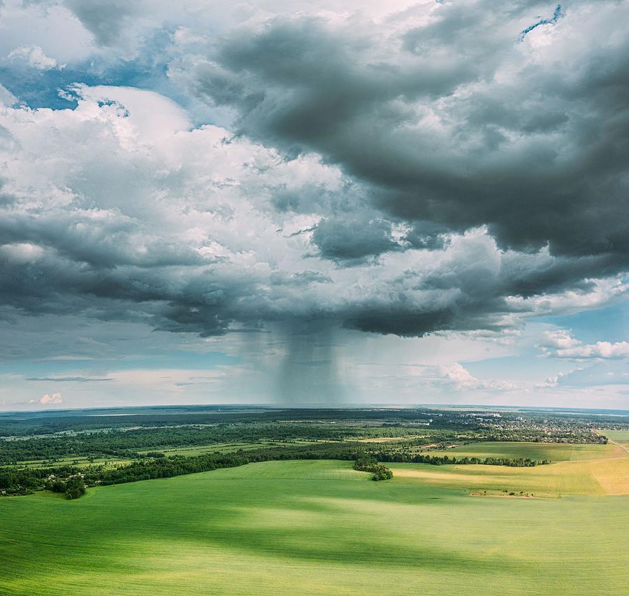 Nature Photograph - Aerial View Of Rain Above Countryside by Ryhor Bruyeu