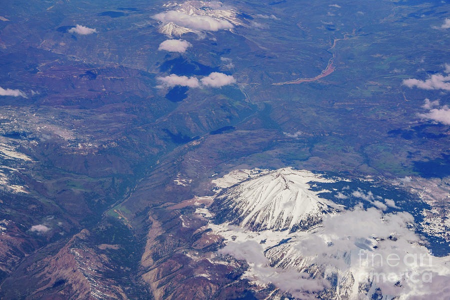 Aerial view of snowy West Beckwith Peak mountain near Denver Photograph