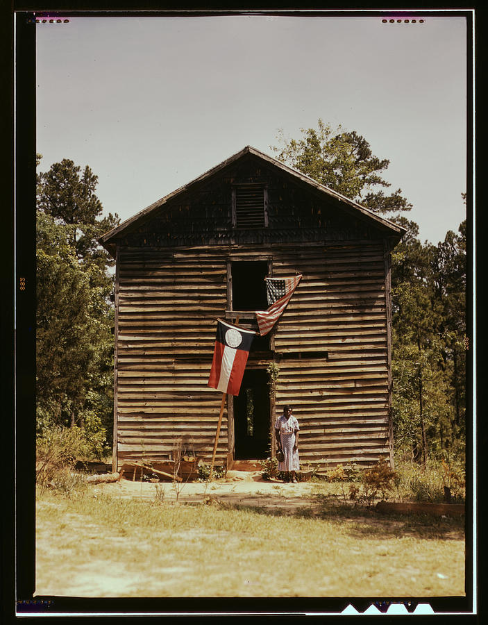 African American Women stands by a Shack Painting by Delano, Jack