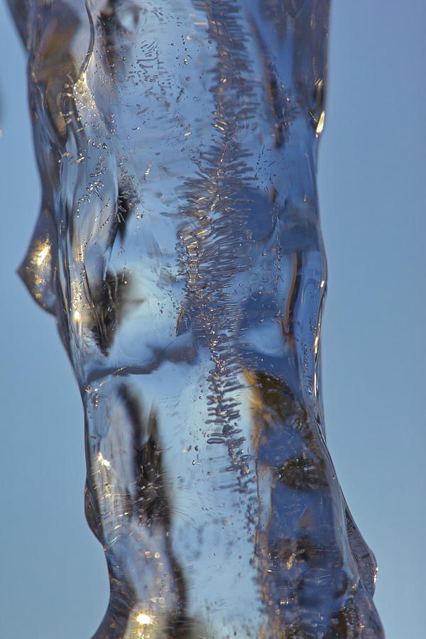 Air bubbles are eclosed in a single icicle Photograph by Intensivelight