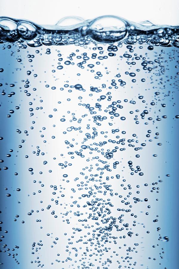 Air Bubbles Rising Through Water close-up Photograph by Krger & Gross
