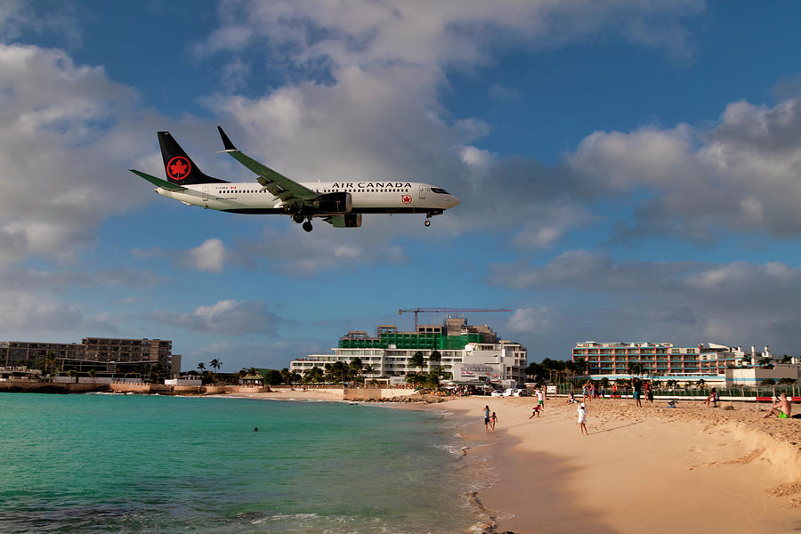 Air Canada landing at St Maarten airport Photograph by David Gleeson