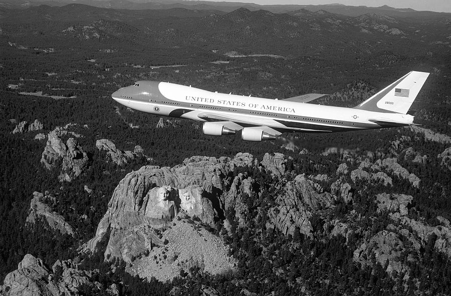 Air Force One flying over Mount Rushmore - 1990 Photograph by War Is Hell Store