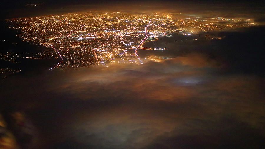 Air Travel - City Lights Below Photograph by Florian Kainz
