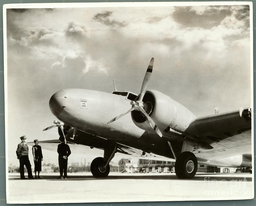 Airline Employees Standing Photograph by Bettmann